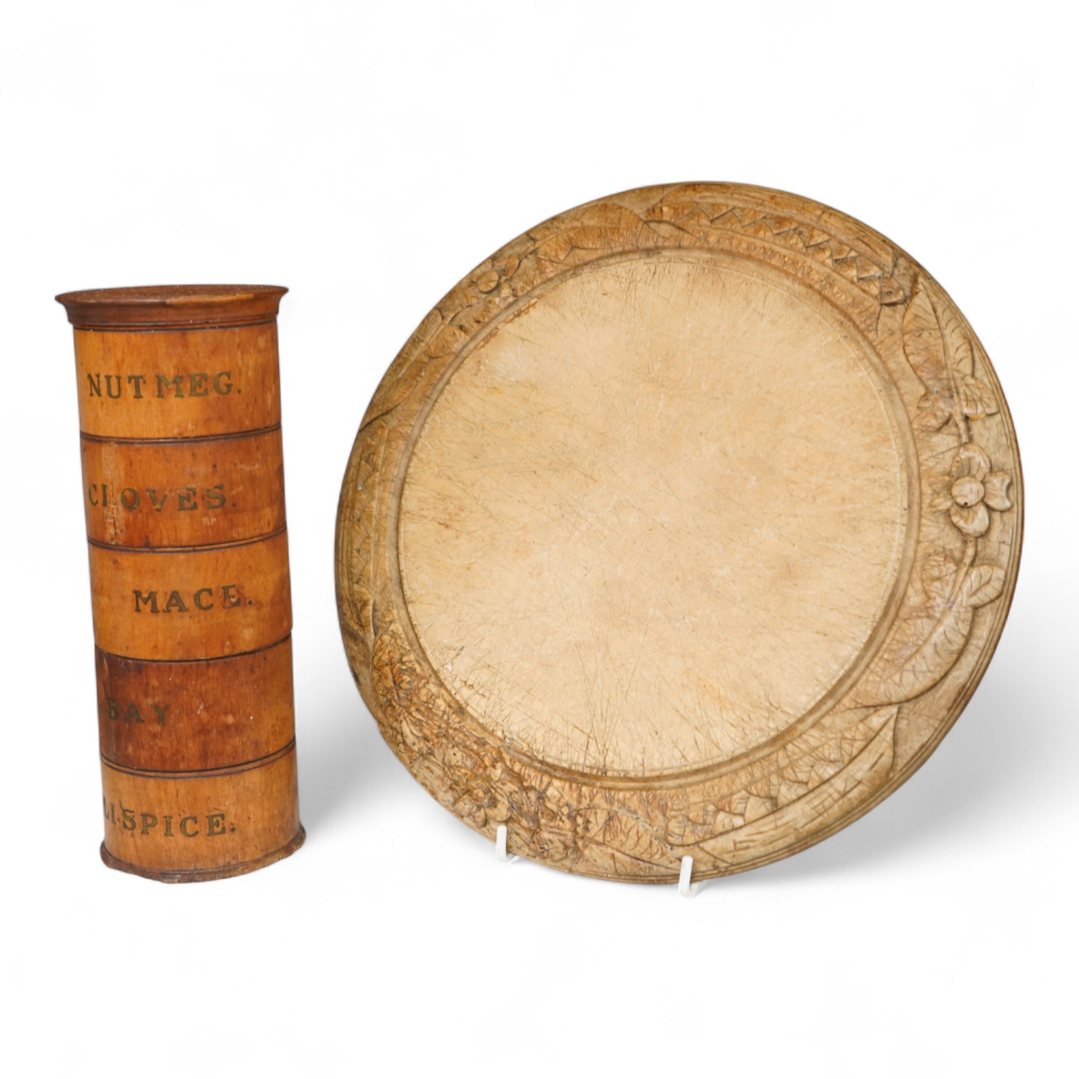 A Victorian treen spice tower and a carved bread board, 30cm in diameter